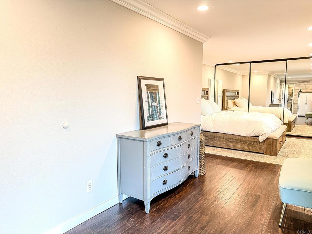 751 South Grade Road Alpine, CA 91901 - Photo 44 of 67 a bedroom with a bed and wooden floor