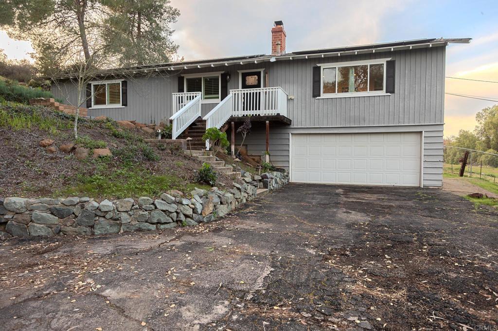 751 South Grade Road Alpine, CA 91901 - Photo 5 of 67 a front view of a house with garden