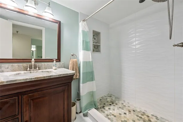 a bathroom with a sink and a mirror