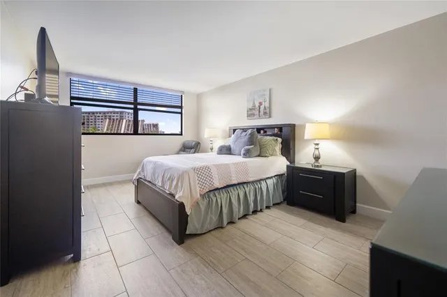 a bedroom with a bed and dresser