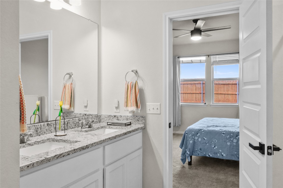 323 Tolo Drive Elgin, TX 78621 - Photo 17 of 32 Ensuite bathroom featuring double vanity and a ceiling fan