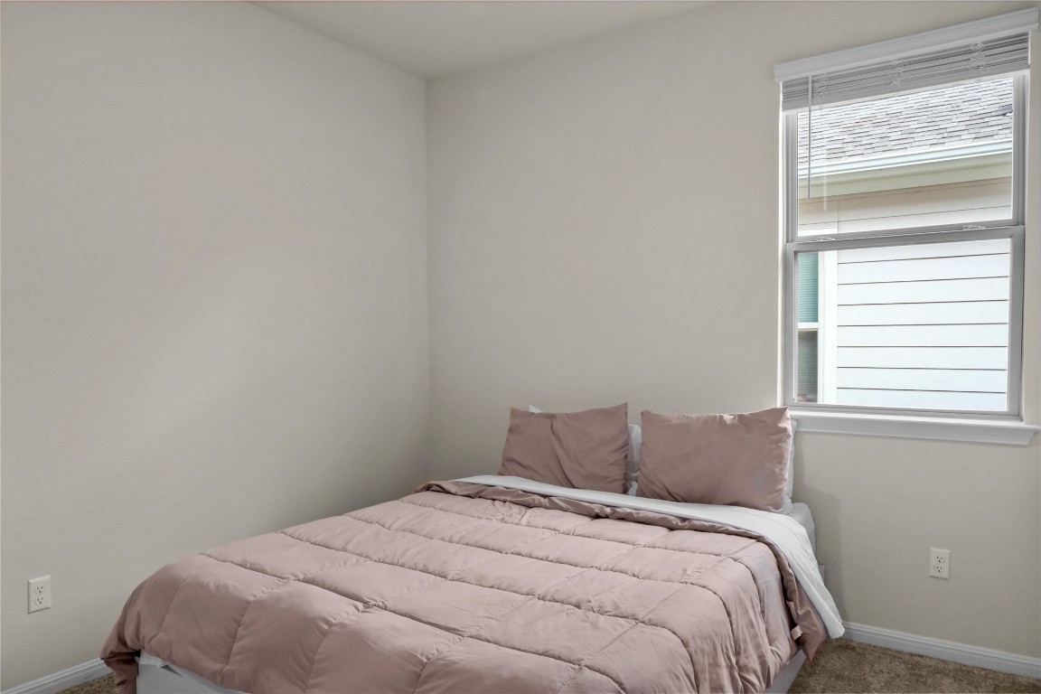 323 Tolo Drive Elgin, TX 78621 - Photo 20 of 32 2nd Bedroom featuring baseboards and carpet floors