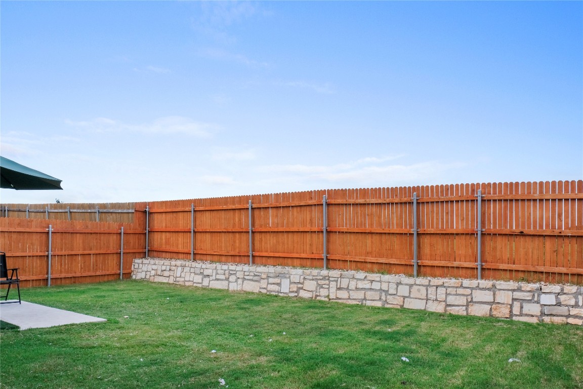 323 Tolo Drive Elgin, TX 78621 - Photo 24 of 32 View of fenced backyard