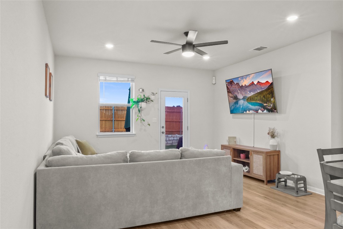 323 Tolo Drive Elgin, TX 78621 - Photo 9 of 32 Living area featuring wood finished floors, ceiling fan, and recessed lighting