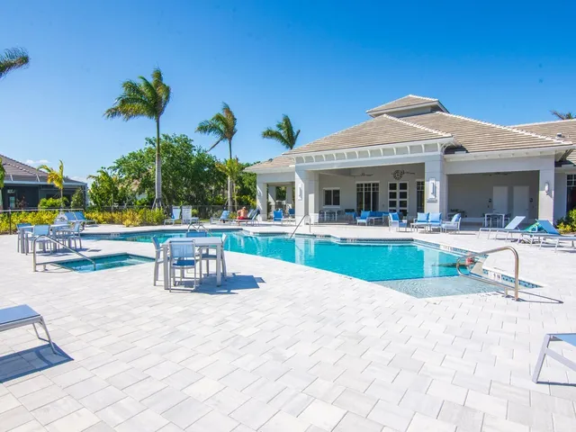 a view of a swimming pool with a table and chairs