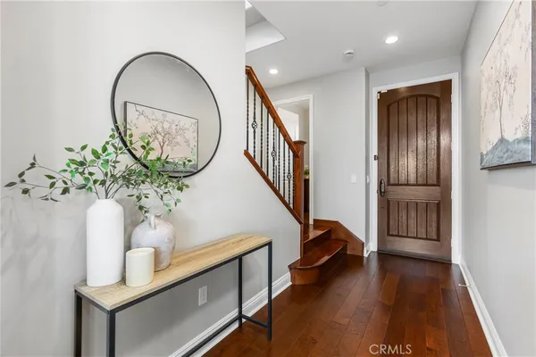 a view of entryway with wooden floor and a potted plant