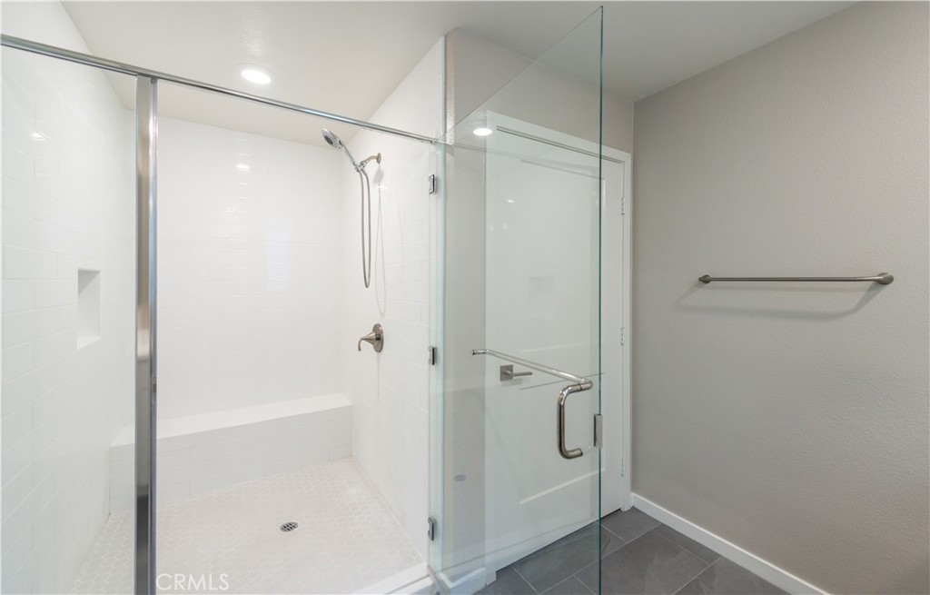 185 Bowery Irvine, CA 92612 - Photo 26 of 29 a bathroom with a glass shower door