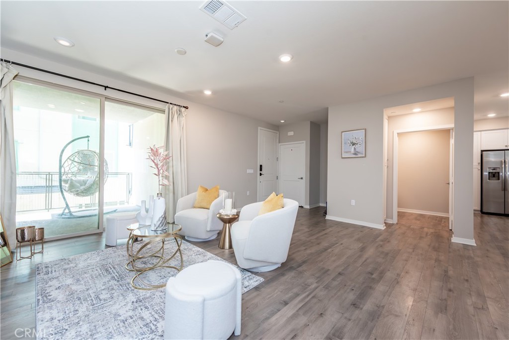 185 Bowery Irvine, CA 92612 - Photo 7 of 29 a living room with furniture and a large window