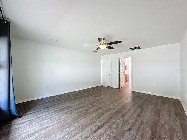 a spacious bathroom with a double vanity sink and a mirror