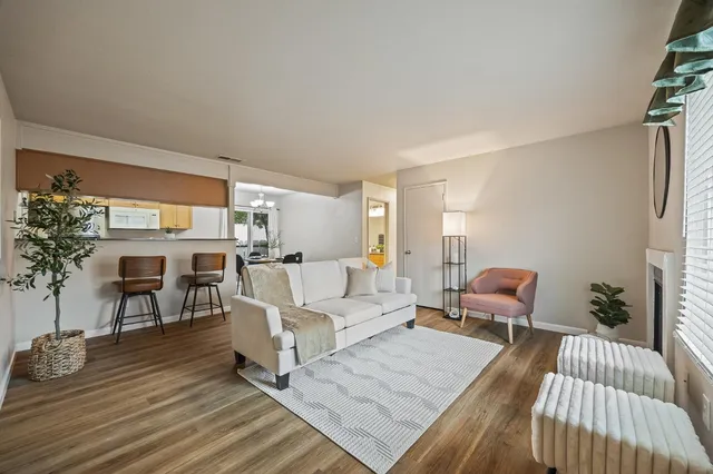 a living room with furniture and a table