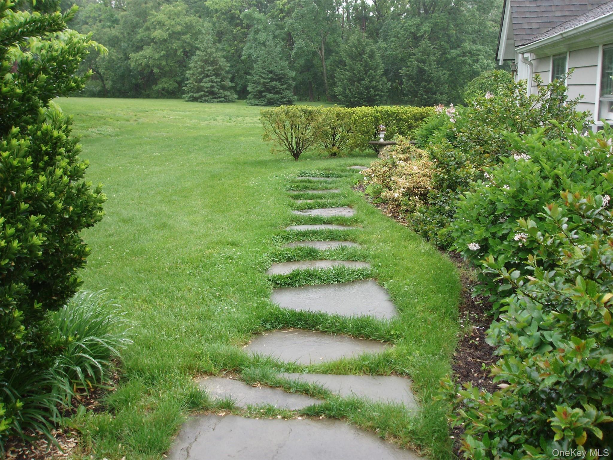 953 Ripley Lane Oyster Bay, NY 11771 - Photo 21 of 21 a view of a grassy area