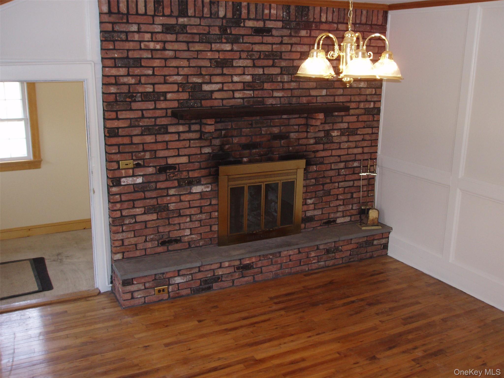 953 Ripley Lane Oyster Bay, NY 11771 - Photo 4 of 21 a living room with a fireplace