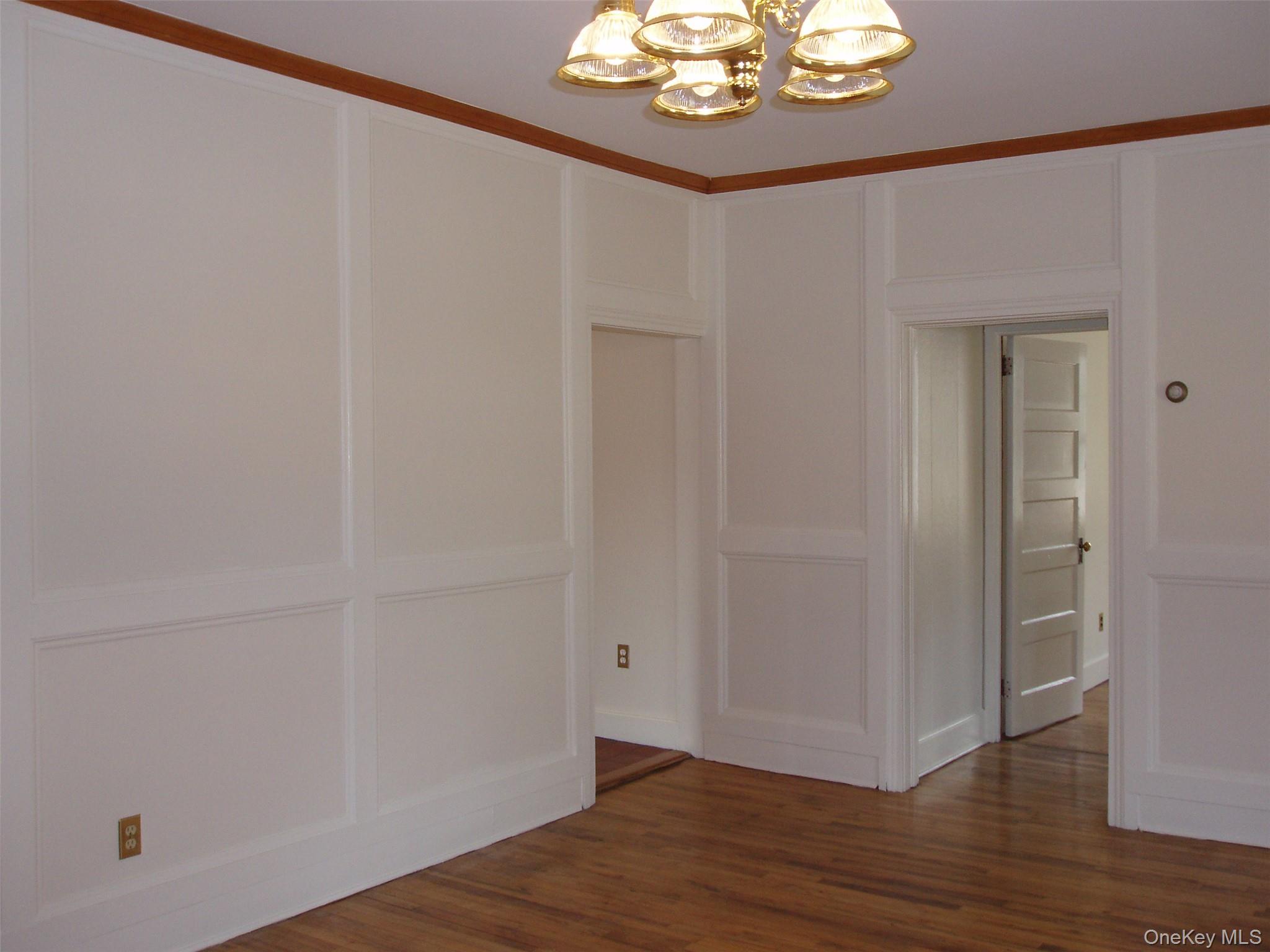 953 Ripley Lane Oyster Bay, NY 11771 - Photo 5 of 21 a view of a hallway with wooden floor