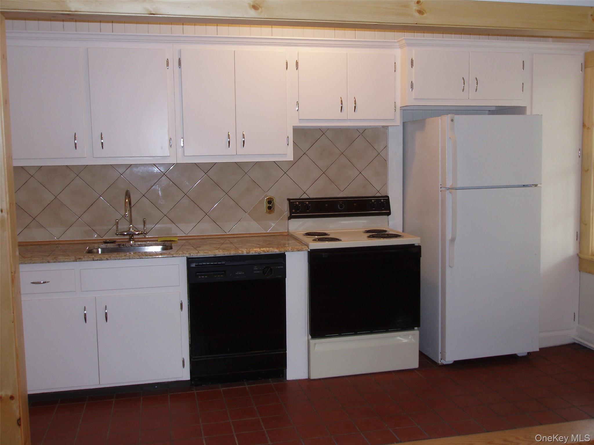 953 Ripley Lane Oyster Bay, NY 11771 - Photo 10 of 21 a kitchen with stainless steel appliances granite countertop a refrigerator and a stove