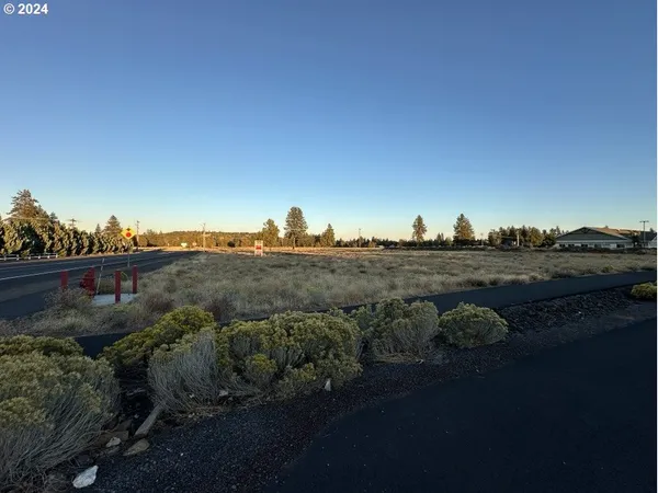 a view of a lake with a yard