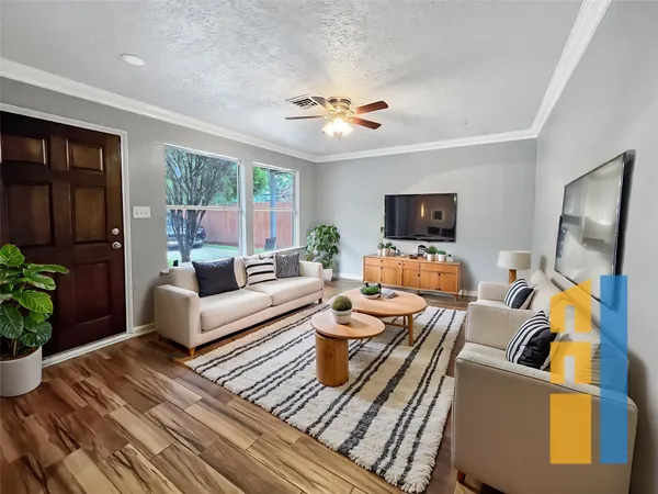 a living room with furniture fireplace and a flat screen tv