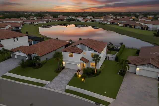 an aerial view of a house with outdoor space