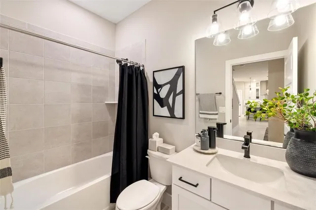 a view of a bedroom with furniture and window