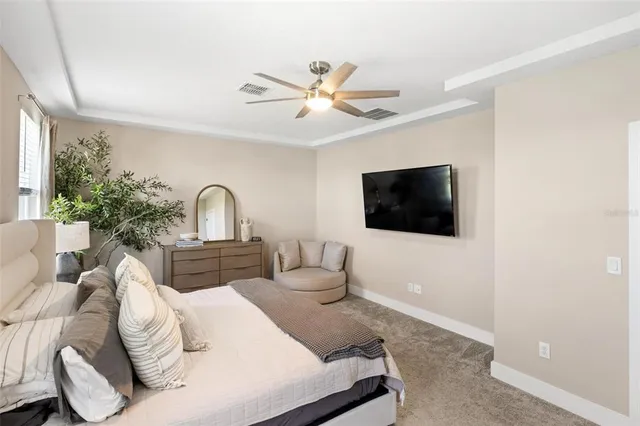 a bathroom with a shower sink and mirror