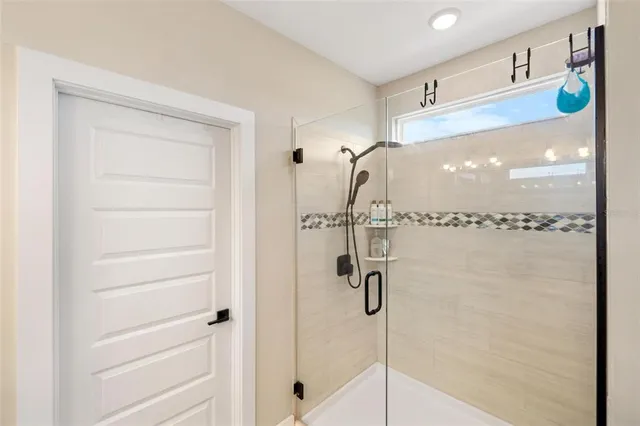 a bedroom with a bed and a lamp with wooden floor