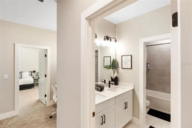 a living room with furniture and a mirror