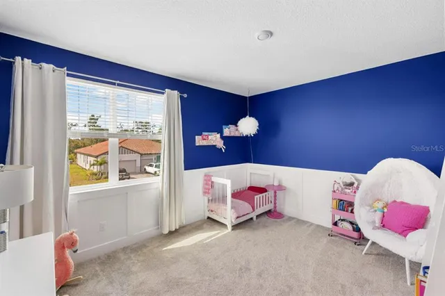 a view of a chairs and tables in the back yard of the house