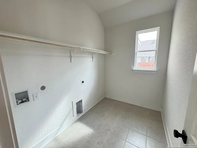 a view of a large pool with a yard in front of the house