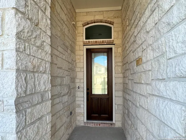 a large kitchen with kitchen island a sink stainless steel appliances and cabinets