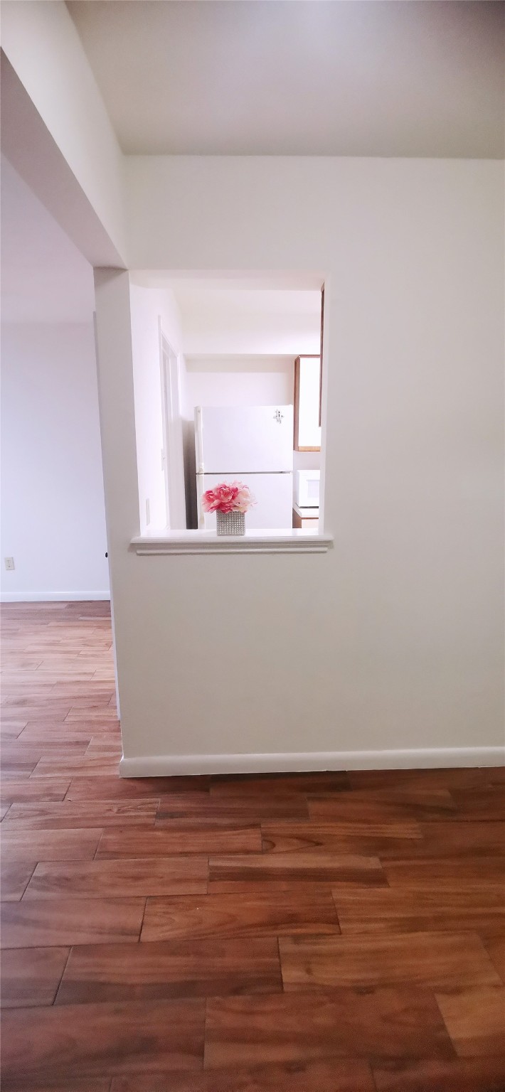 8313 Augustine Drive, Unit B Houston, TX 77036 - Photo 14 of 34 a view of a room with wooden floor and window