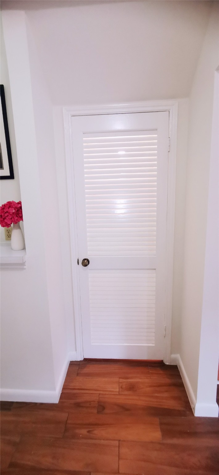 8313 Augustine Drive, Unit B Houston, TX 77036 - Photo 15 of 34 a view of an empty room with wooden floor and closet