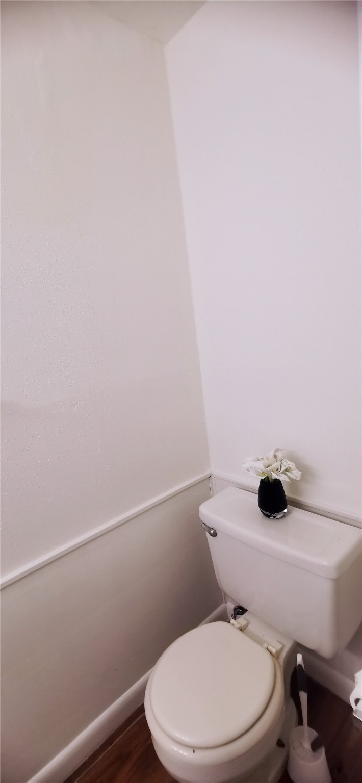 8313 Augustine Drive, Unit B Houston, TX 77036 - Photo 17 of 34 a white toilet sitting next to a shower