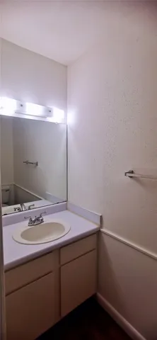 a bathroom with a sink and vanity