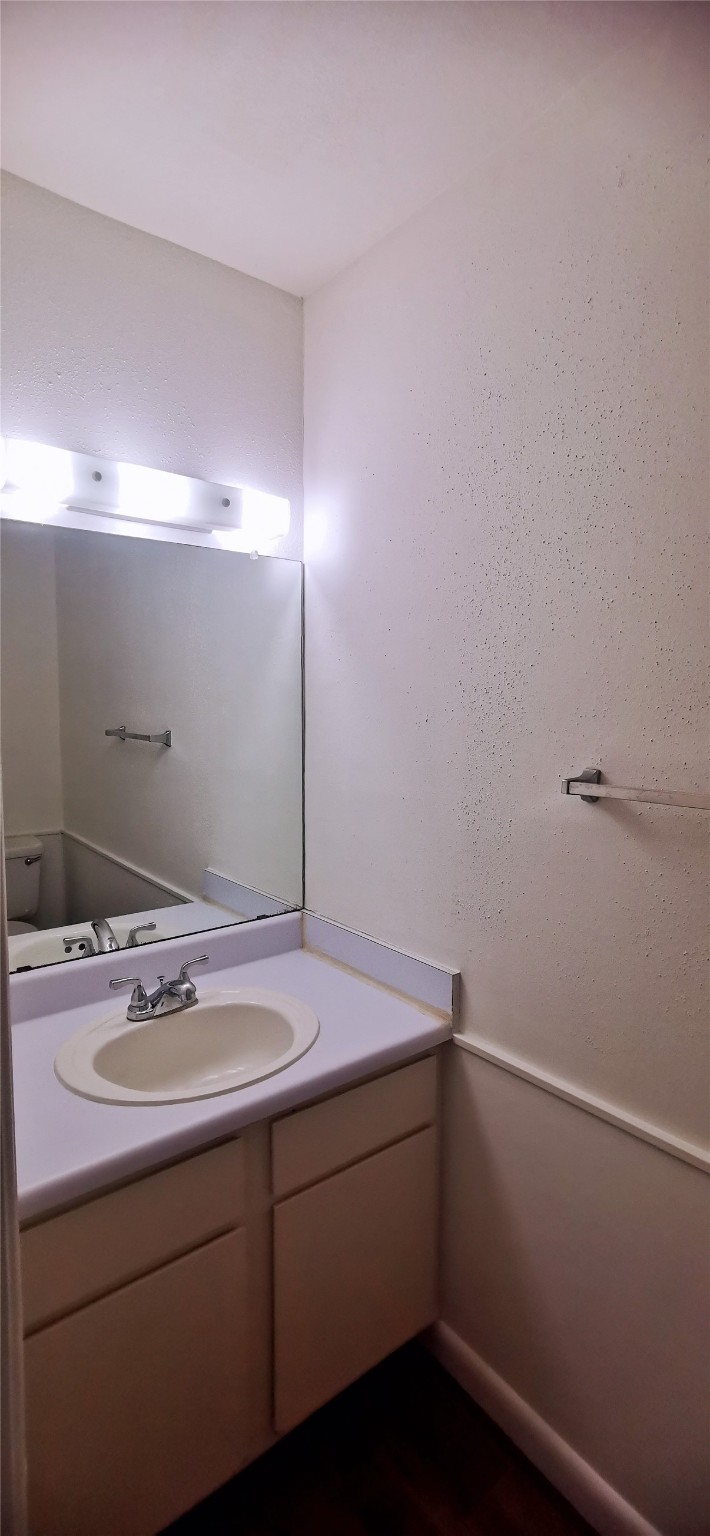 8313 Augustine Drive, Unit B Houston, TX 77036 - Photo 18 of 34 a bathroom with a sink and vanity