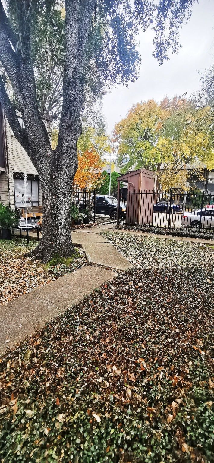 8313 Augustine Drive, Unit B Houston, TX 77036 - Photo 2 of 34 a view of a yard with wooden fence