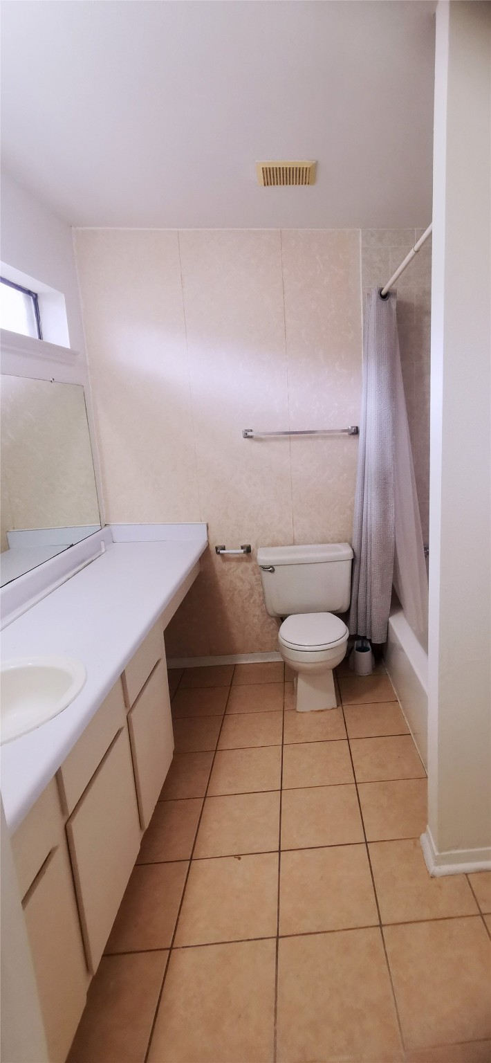 8313 Augustine Drive, Unit B Houston, TX 77036 - Photo 25 of 34 a bathroom with a sink and a toilet