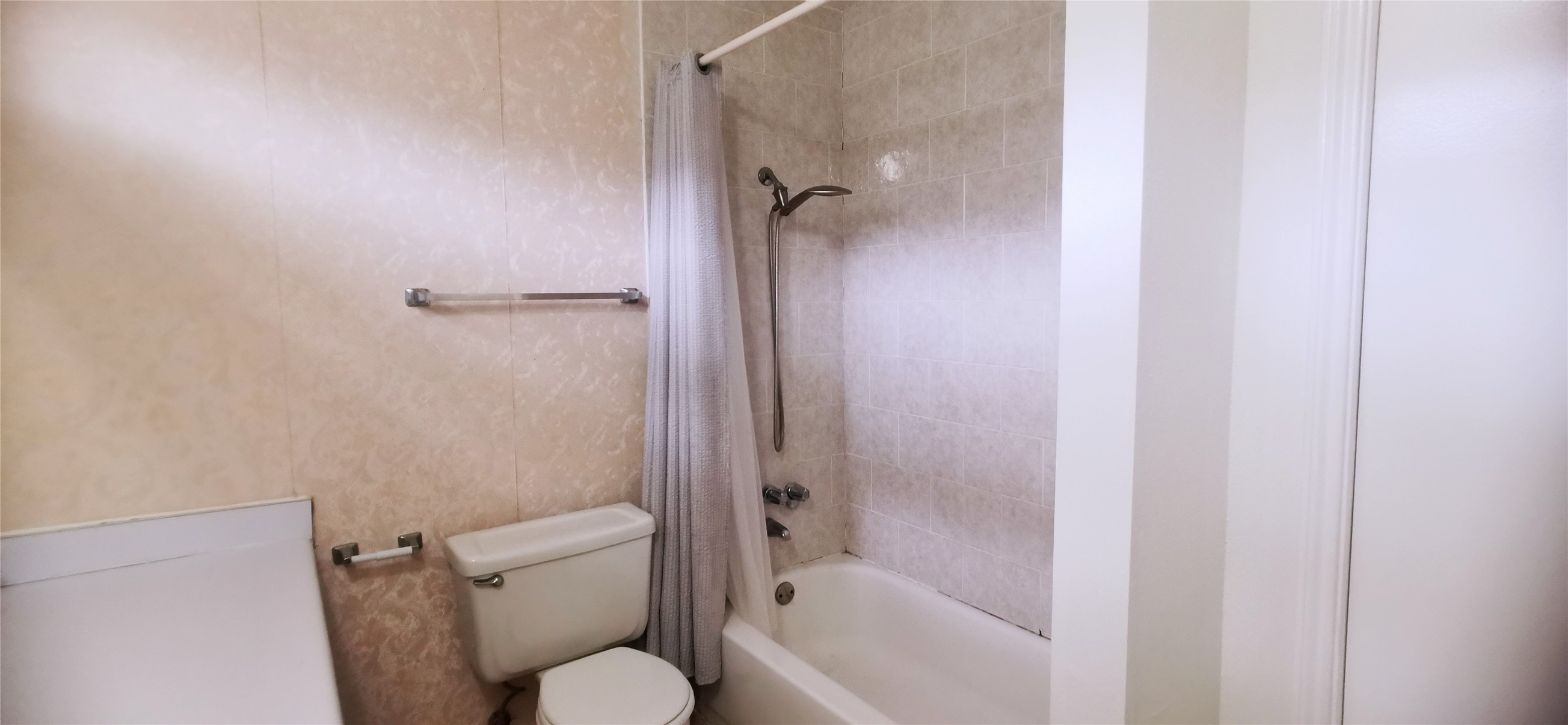 8313 Augustine Drive, Unit B Houston, TX 77036 - Photo 26 of 34 a bathroom with a shower and toilet