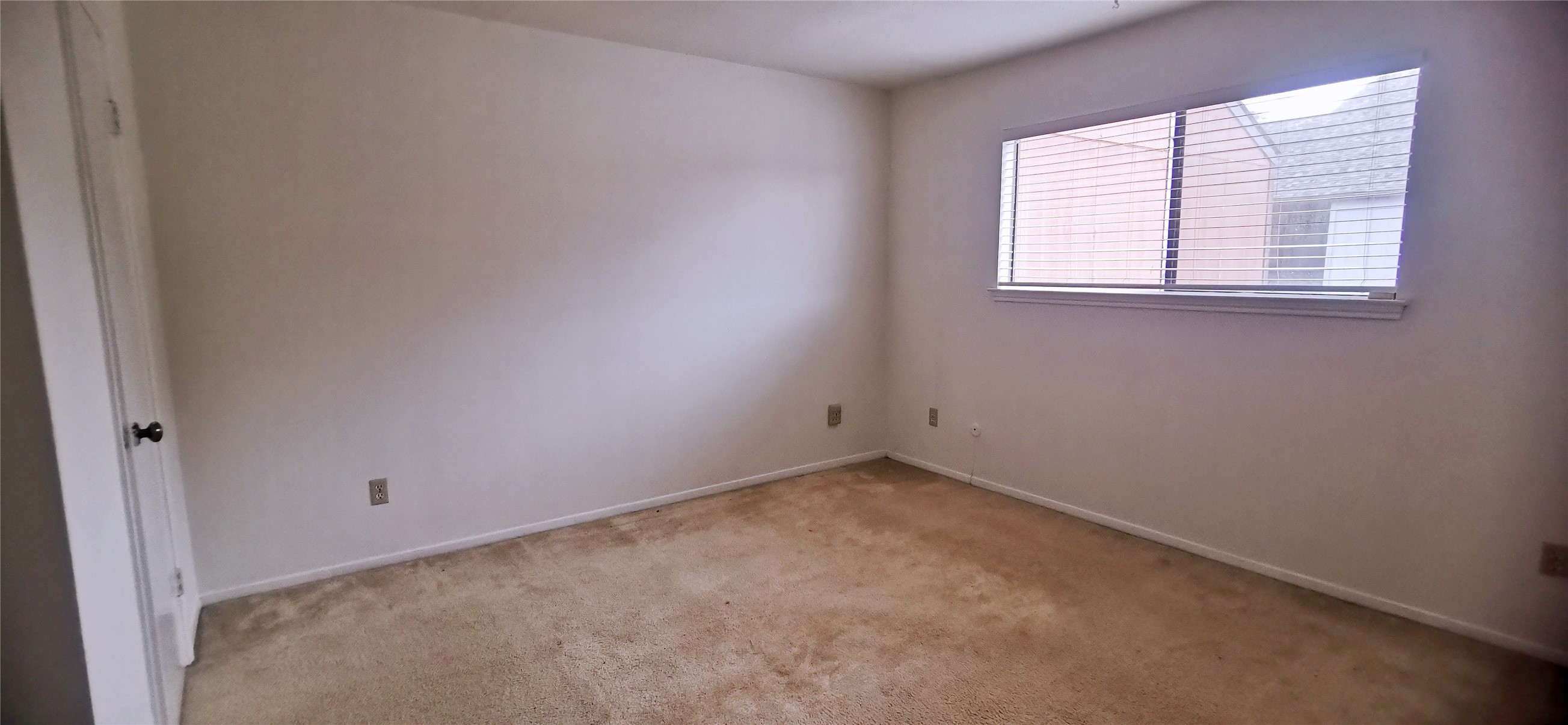 8313 Augustine Drive, Unit B Houston, TX 77036 - Photo 31 of 34 an empty room with a window