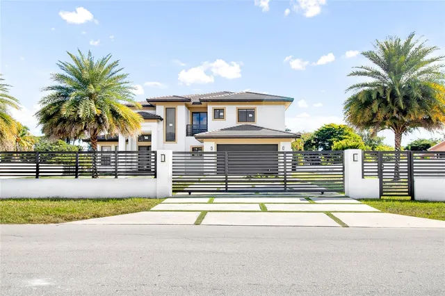 a view of a house with a swimming pool and a chair