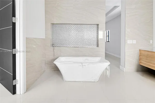 a bathroom with a bathtub and a shower