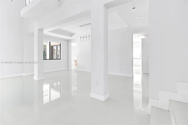 a view of a hallway with white walls