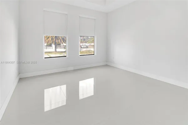 an empty room with windows