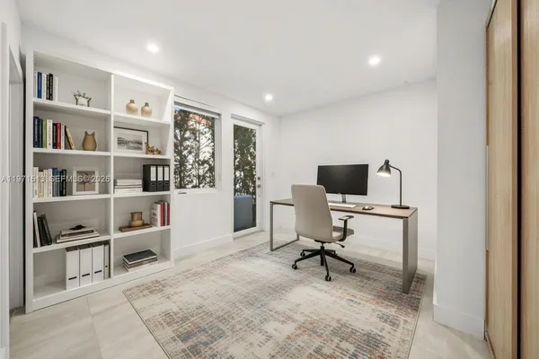 a view of a workspace with furniture