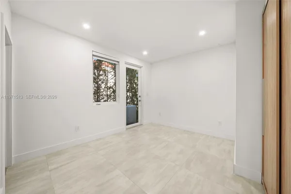 an empty room with windows