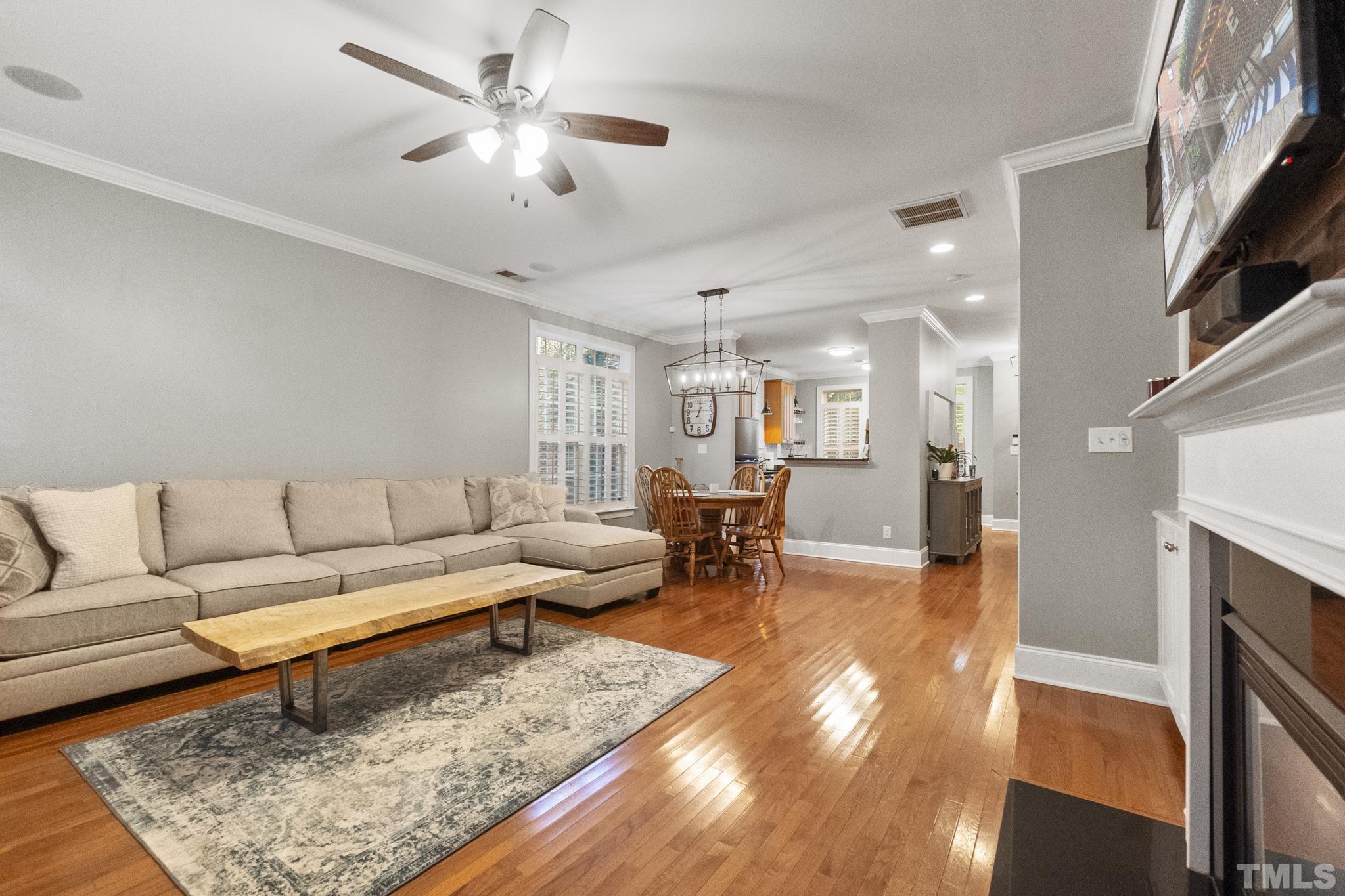 617 Highpark Lane Raleigh, NC 27608 - Photo 12 of 26 a living room with furniture and a fireplace