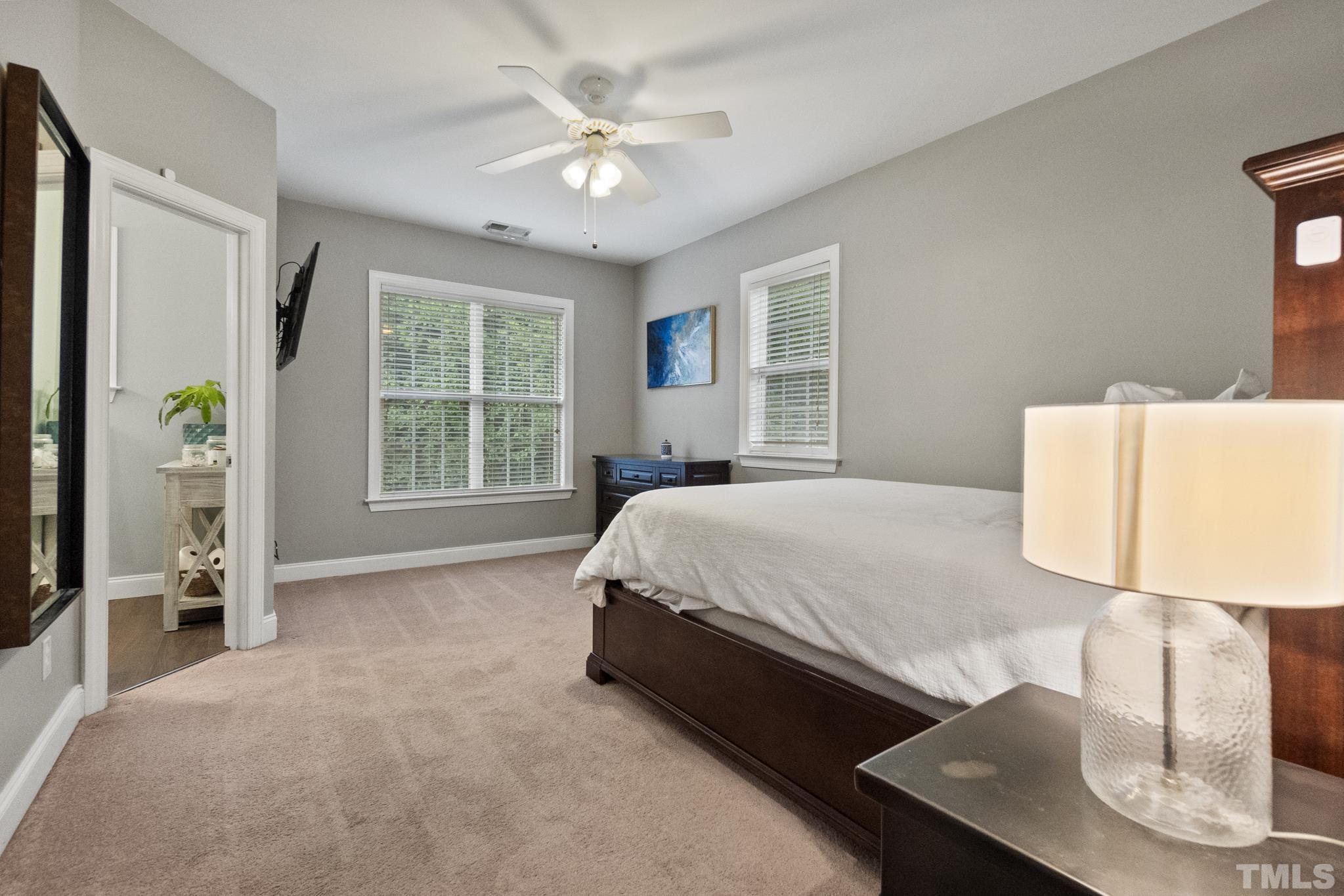 617 Highpark Lane Raleigh, NC 27608 - Photo 15 of 26 a bed sitting in a spacious bedroom next to a window