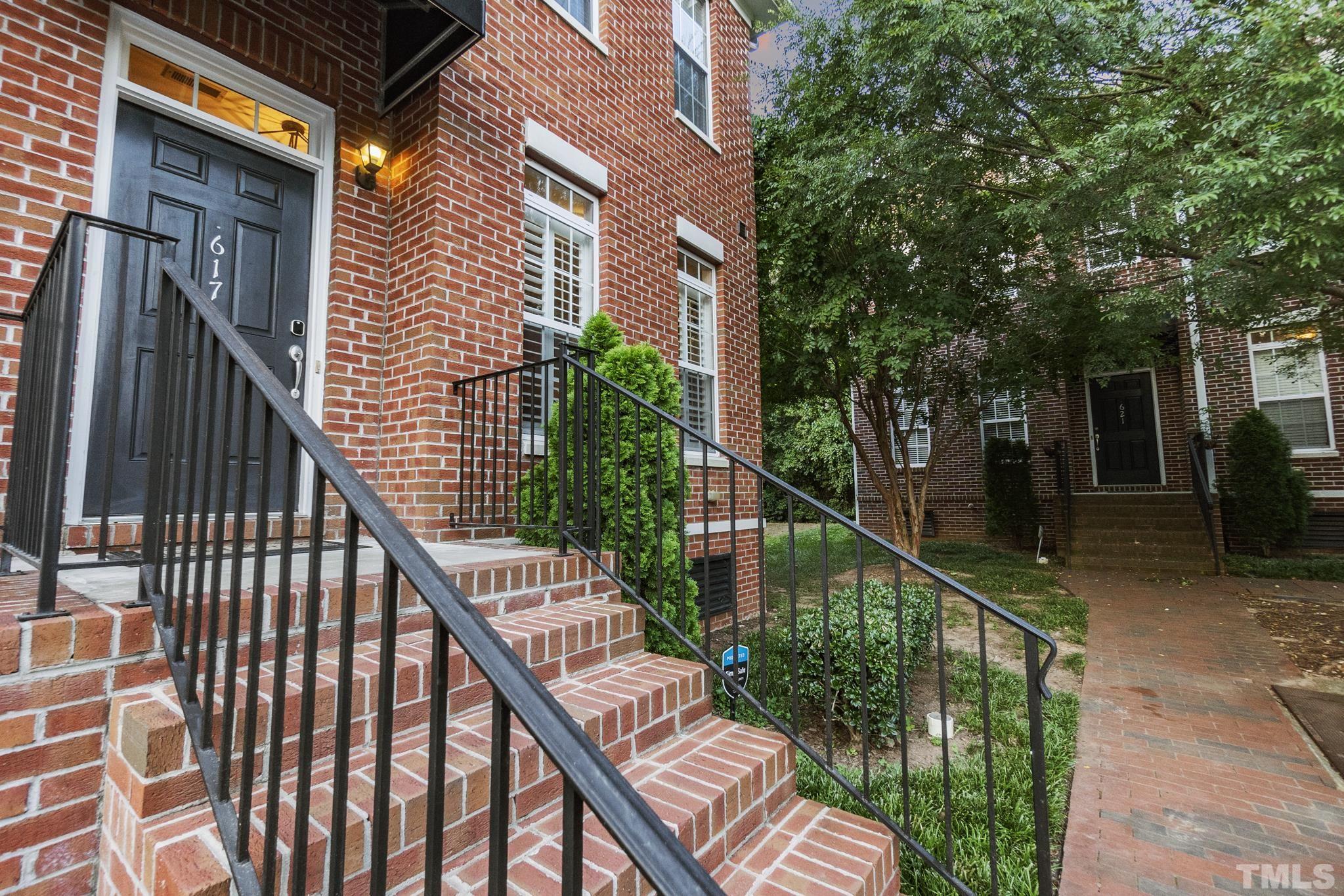 617 Highpark Lane Raleigh, NC 27608 - Photo 2 of 26 a balcony with trees in front of it