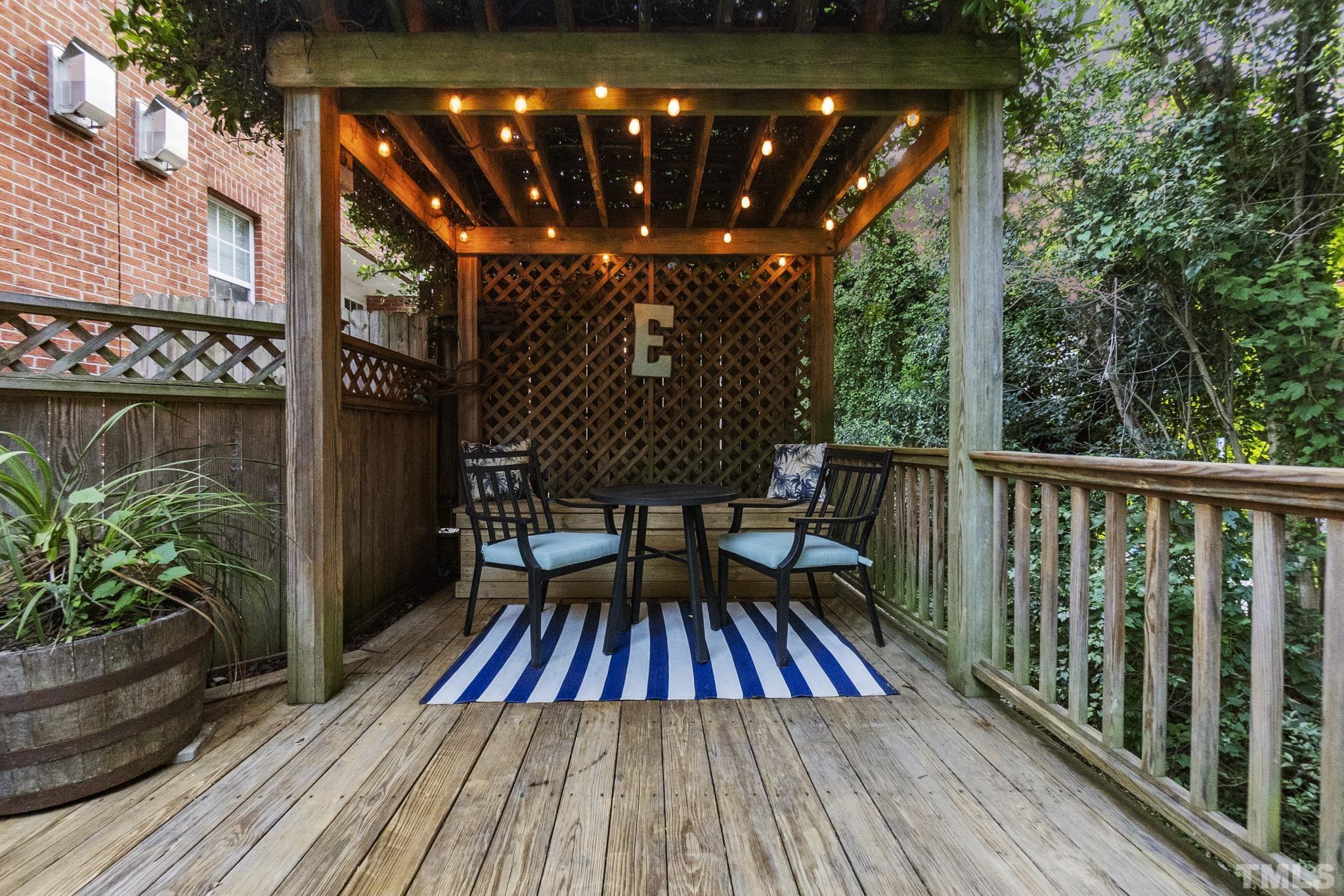 617 Highpark Lane Raleigh, NC 27608 - Photo 24 of 26 a view of balcony with wooden floor and outdoor seating