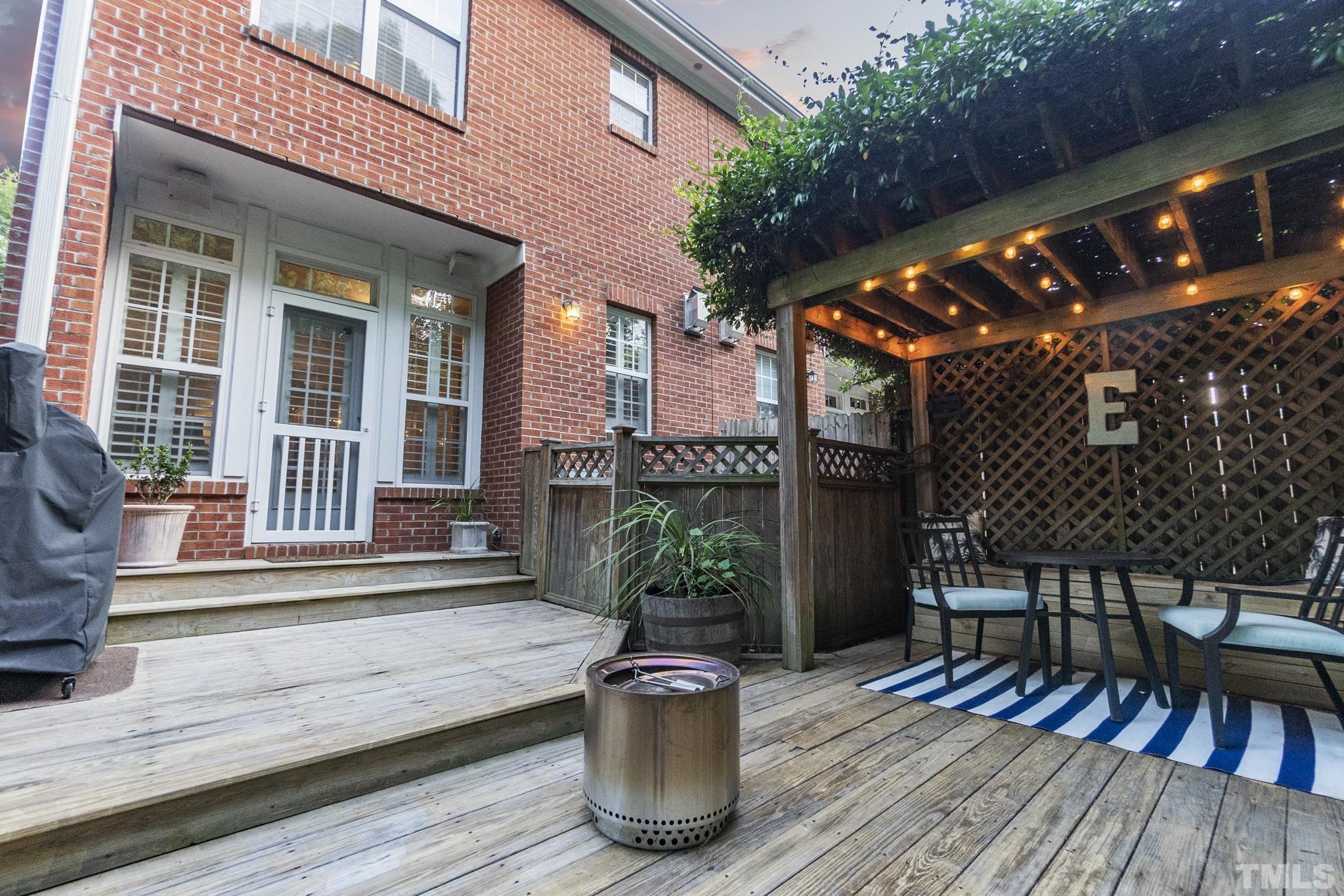 617 Highpark Lane Raleigh, NC 27608 - Photo 26 of 26 a view of sitting area with furniture and wooden fence