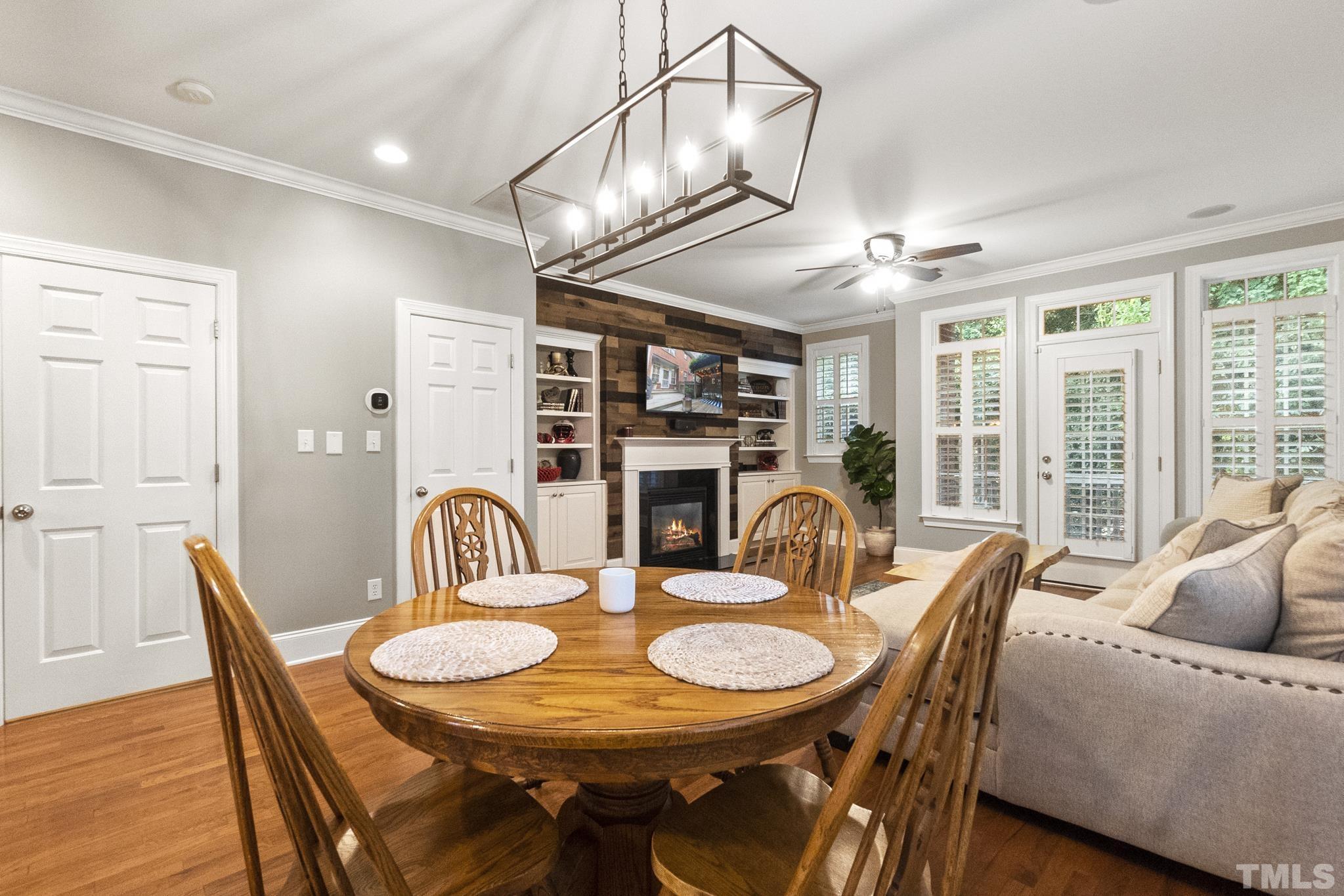 617 Highpark Lane Raleigh, NC 27608 - Photo 8 of 26 a view of a dining room with furniture window and wooden floor