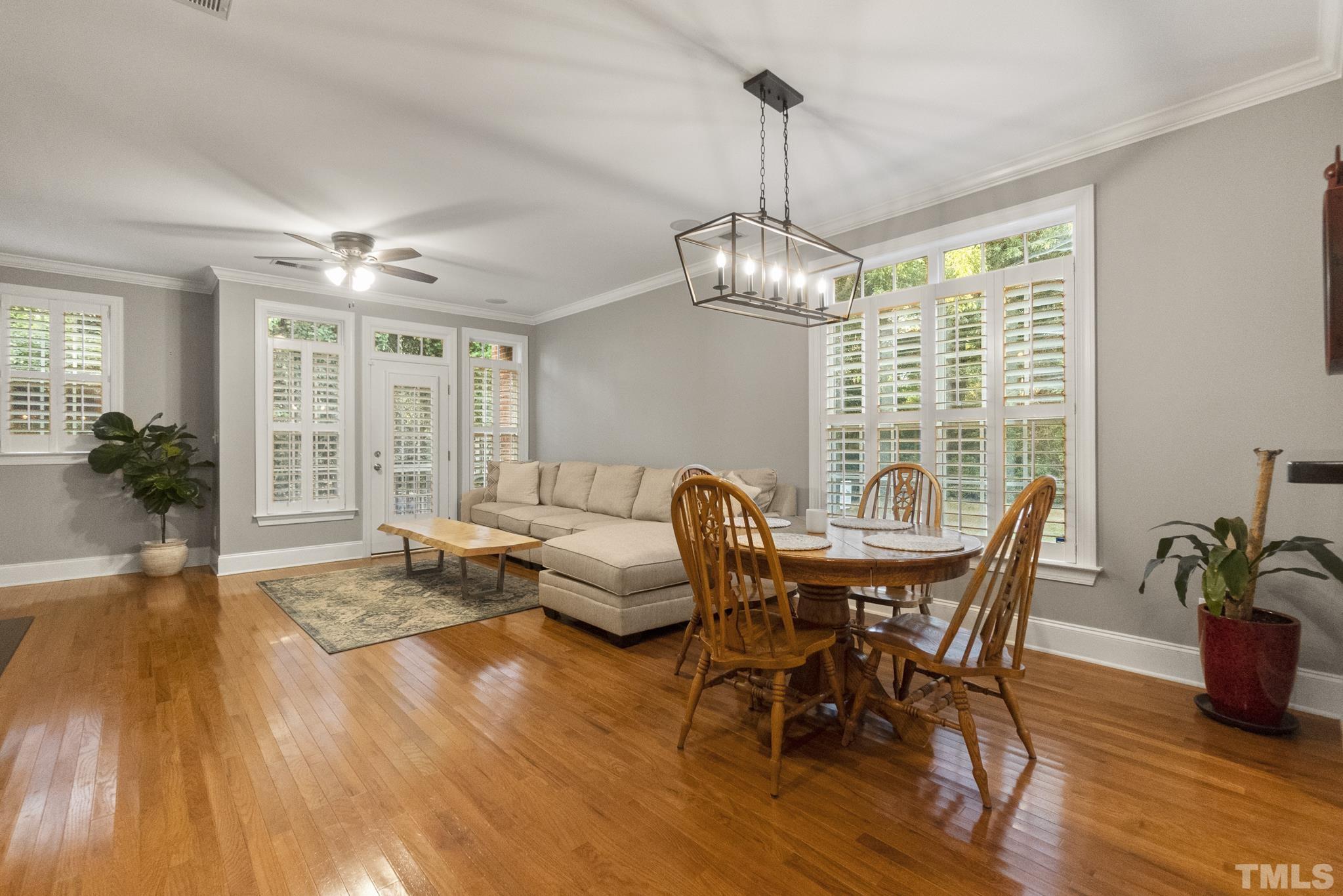 617 Highpark Lane Raleigh, NC 27608 - Photo 9 of 26 a view of a dining room with furniture window and wooden floor